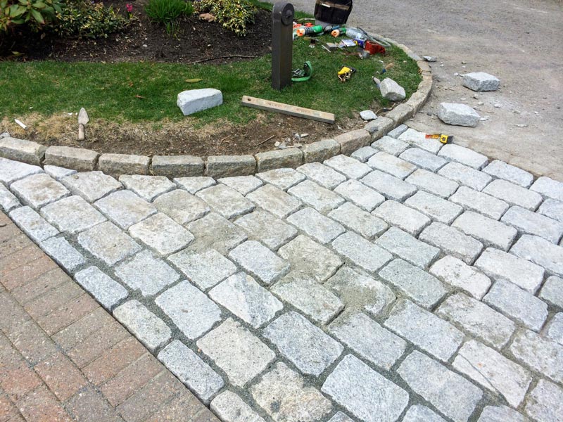 Cobblestone driveway apron.