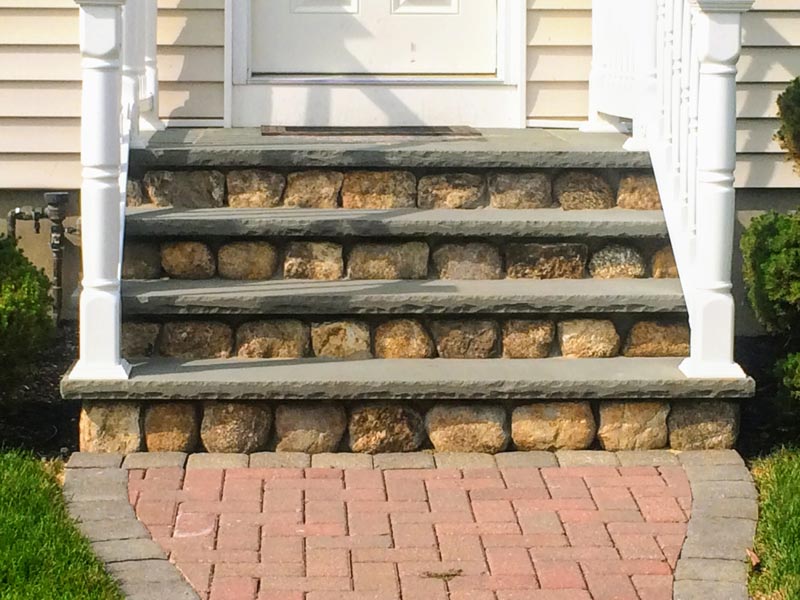 Stone stair entrance into a house.